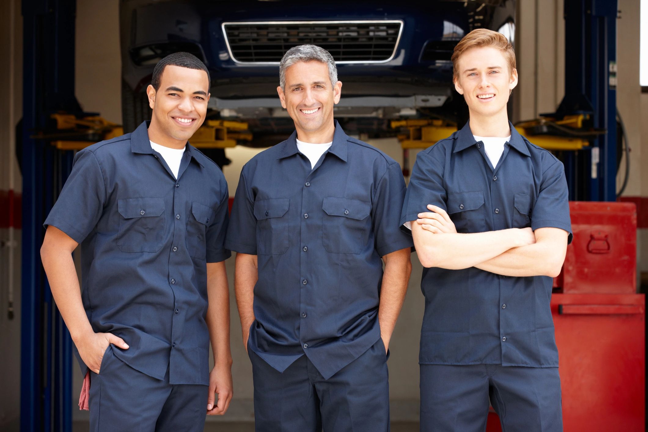 Mechanics standing in a workshop