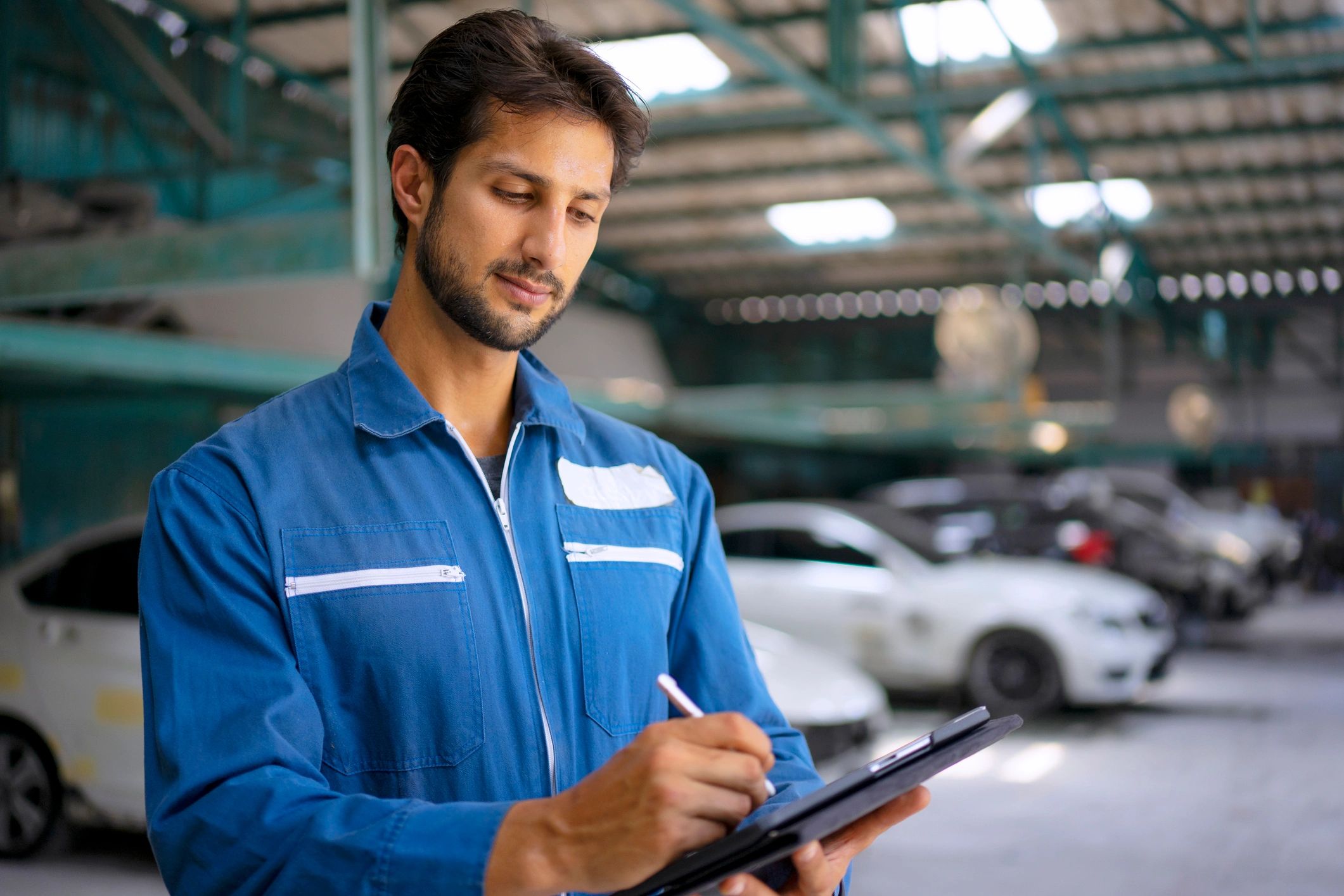Technician reviewing diagnostic information in a garage