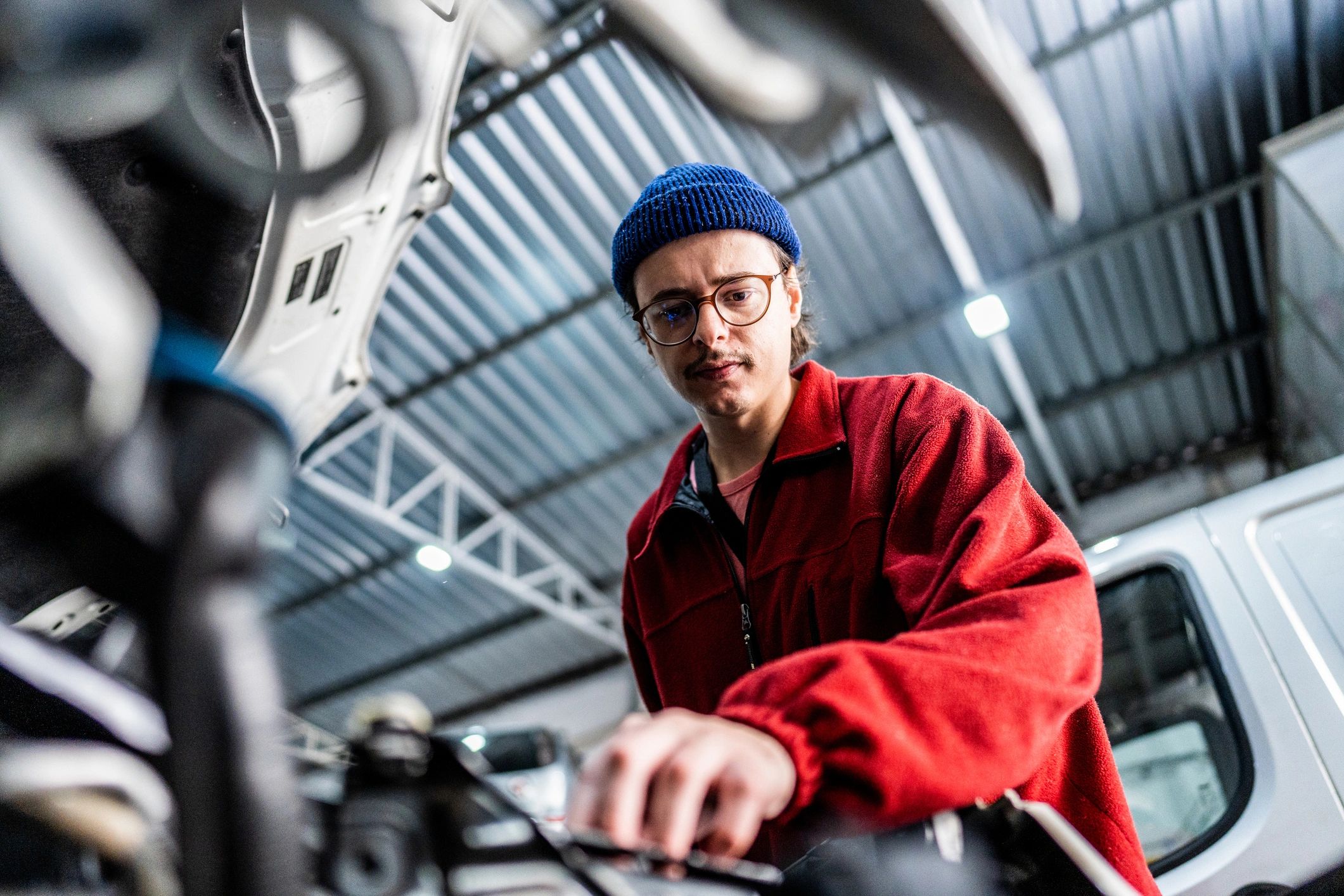 Mechanic repairing a car in an auto repair shop