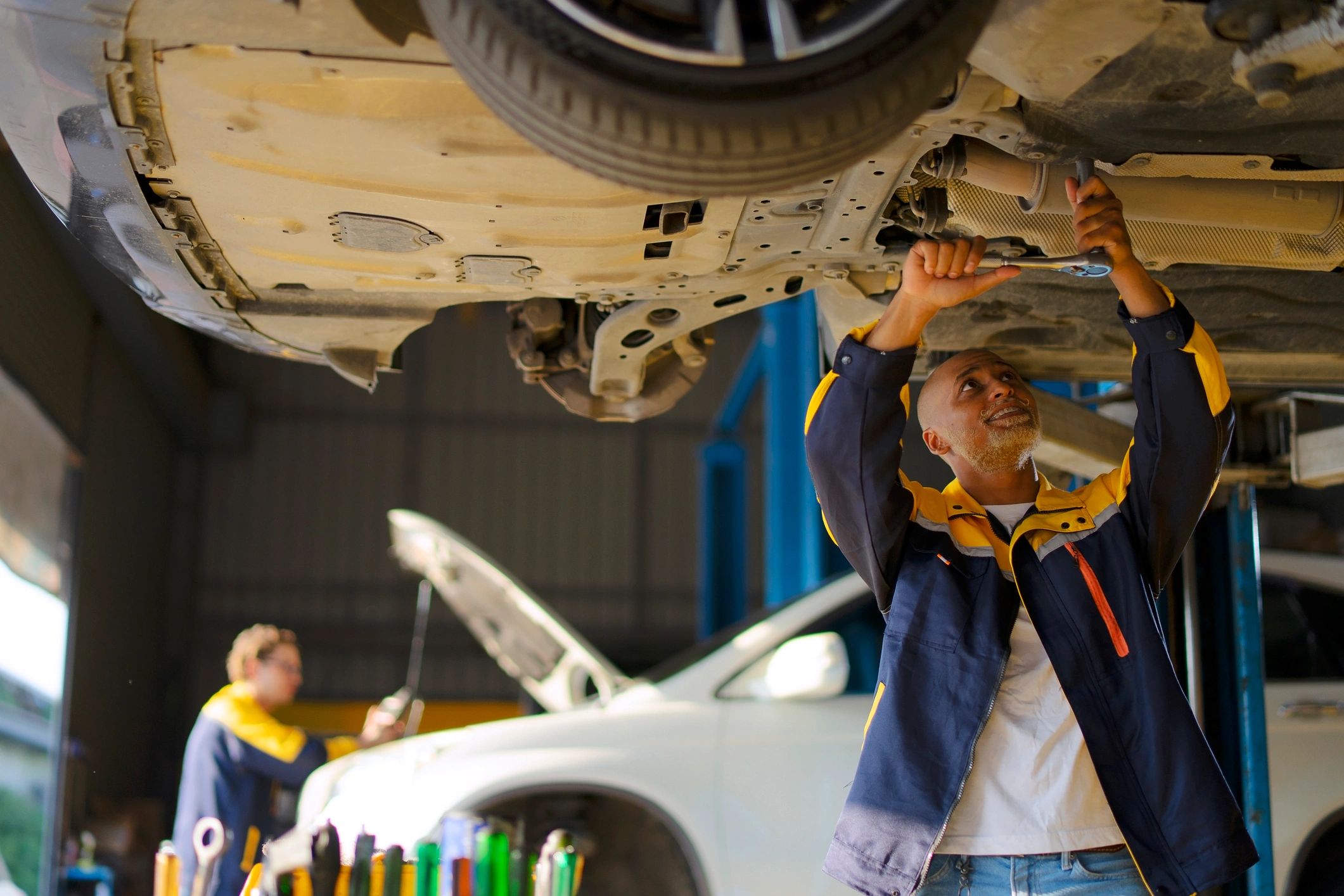 Technician working at a car service workshop