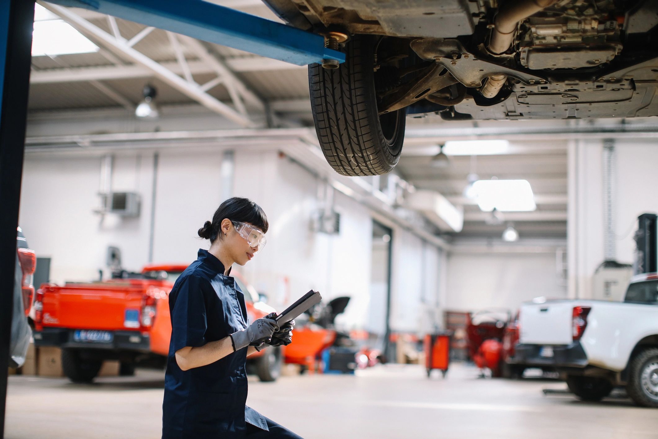 Technician completing a vehicle inspection in a repair bay