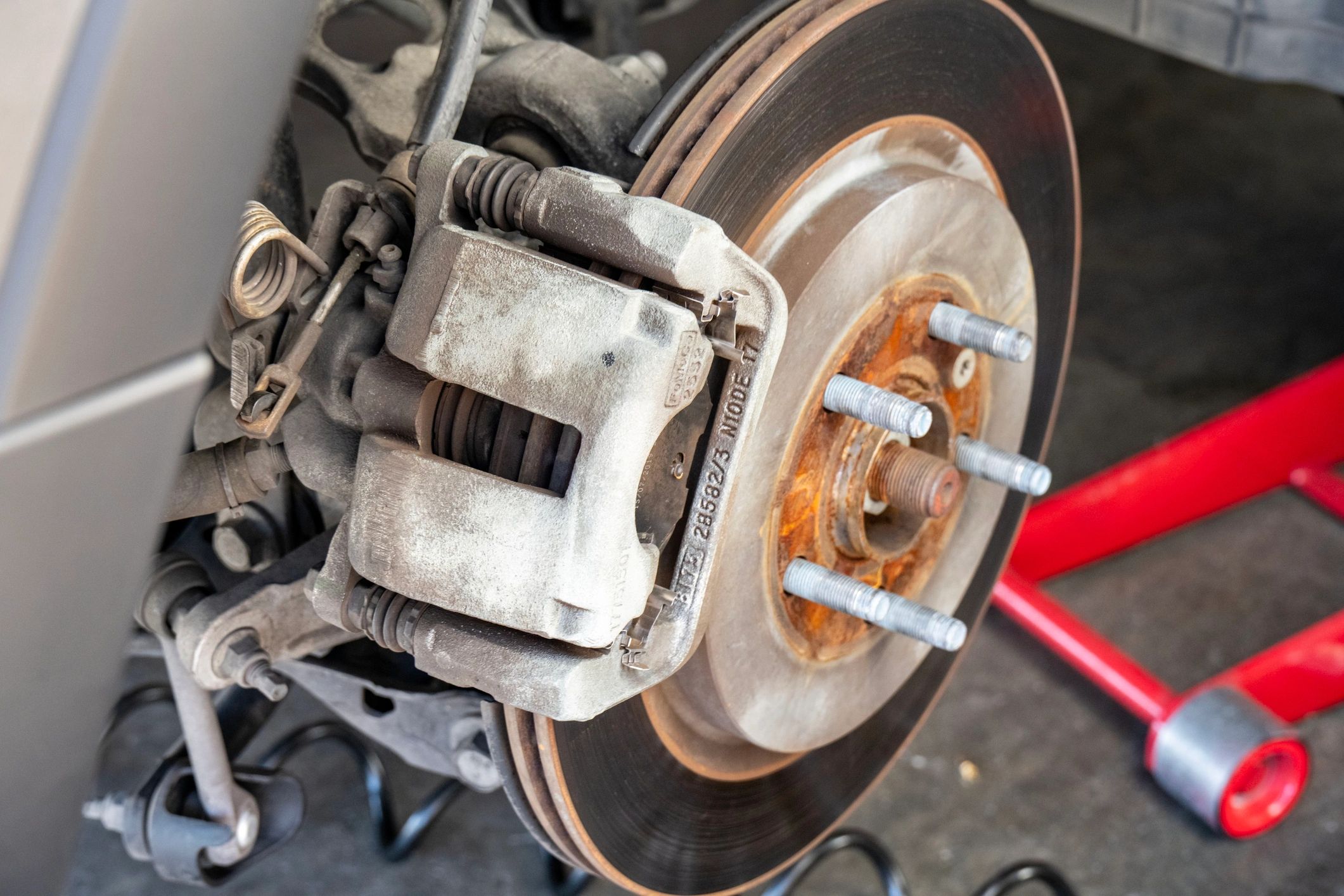 Close-up of a car brake rotor and braking system